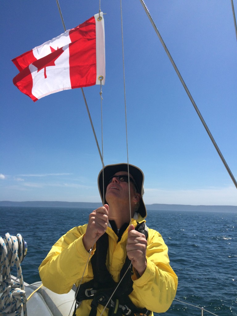 Raising the Canada courtesy flag.